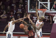 Virginia Tech guard Tyrece Radford (23) has his path to basket blocked by Virginia defenders Braxton Key (2) and Mamadi Diakite (25 ) during the first half of an NCAA college basketball game in Blacksburg, Va., Wednesday, Feb. 26, 2020. (AP Photo/Lee Luther Jr.)