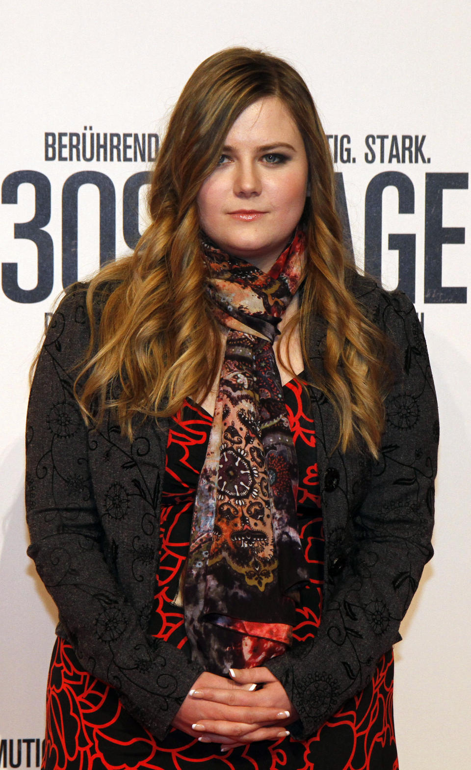 Austrian Natascha Kampusch poses for photographers before the premiere of the film "3096 Days" in Vienna, Austria, Monday Feb. 25, 2013. The film tells the story of Kampusch who was abducted as a schoolgirl and held prisoner in a cellar for almost nine years. (AP Photo/Ronald Zak)