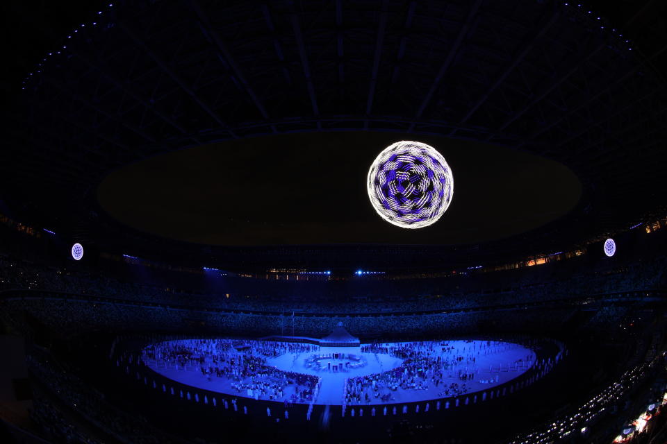 TOKYO, JAPAN - JULY 23: Drones fly over the stadium during the Opening Ceremony of the Tokyo 2020 Olympic Games at Olympic Stadium on July 23, 2021 in Tokyo, Japan. (Photo by Laurence Griffiths/Getty Images)