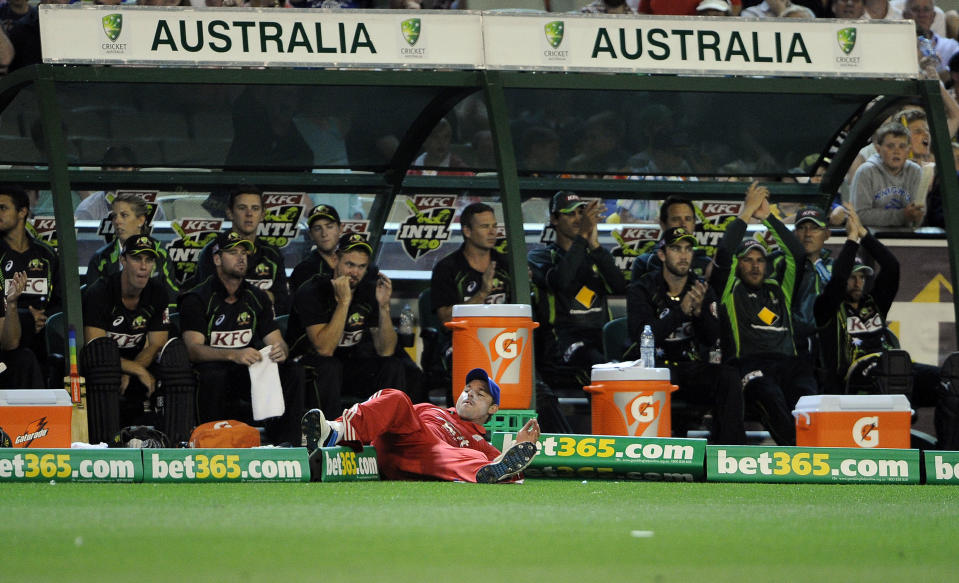 England's Michael Lumb fails to save four runs against Australia during the T20 International cricket match at the Melbourne Cricket Ground in Melbourne, Australia, Friday, Jan. 31, 2014. (AP Photo/Andy Brownbill)