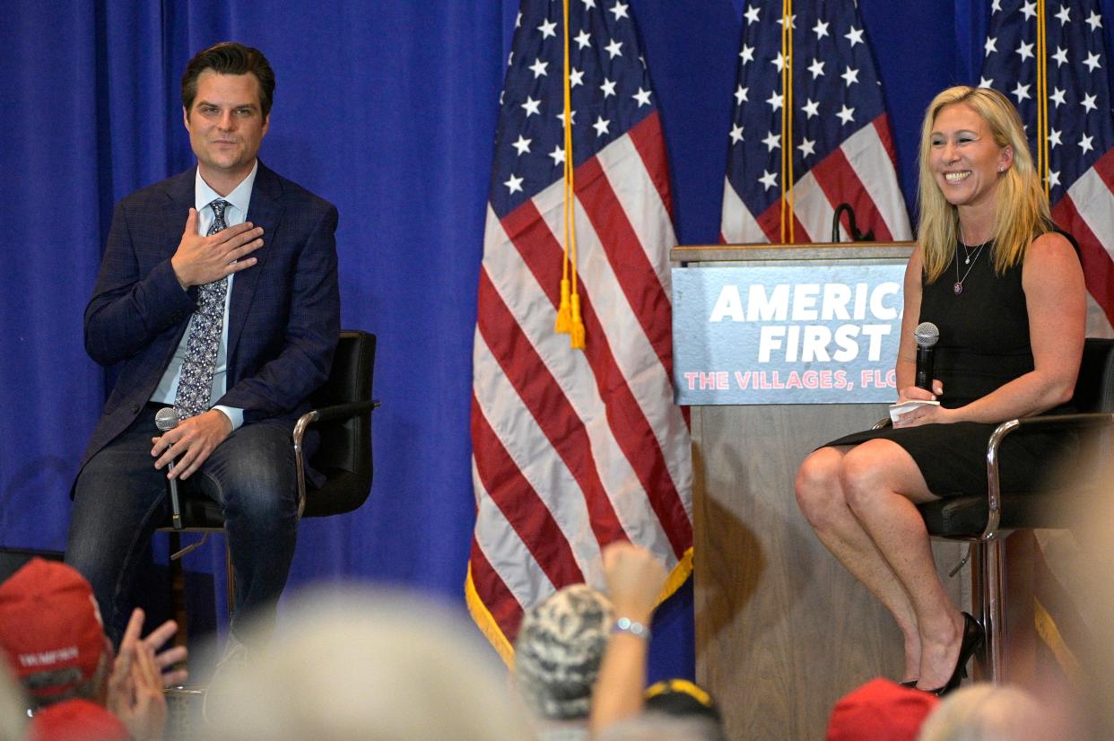 Rep. Matt Gaetz, R-Fla., left, and Rep. Marjorie Taylor Greene, R-Ga., address attendees of a rally, Friday, May 7, 2021, in The Villages, Fla. (AP)