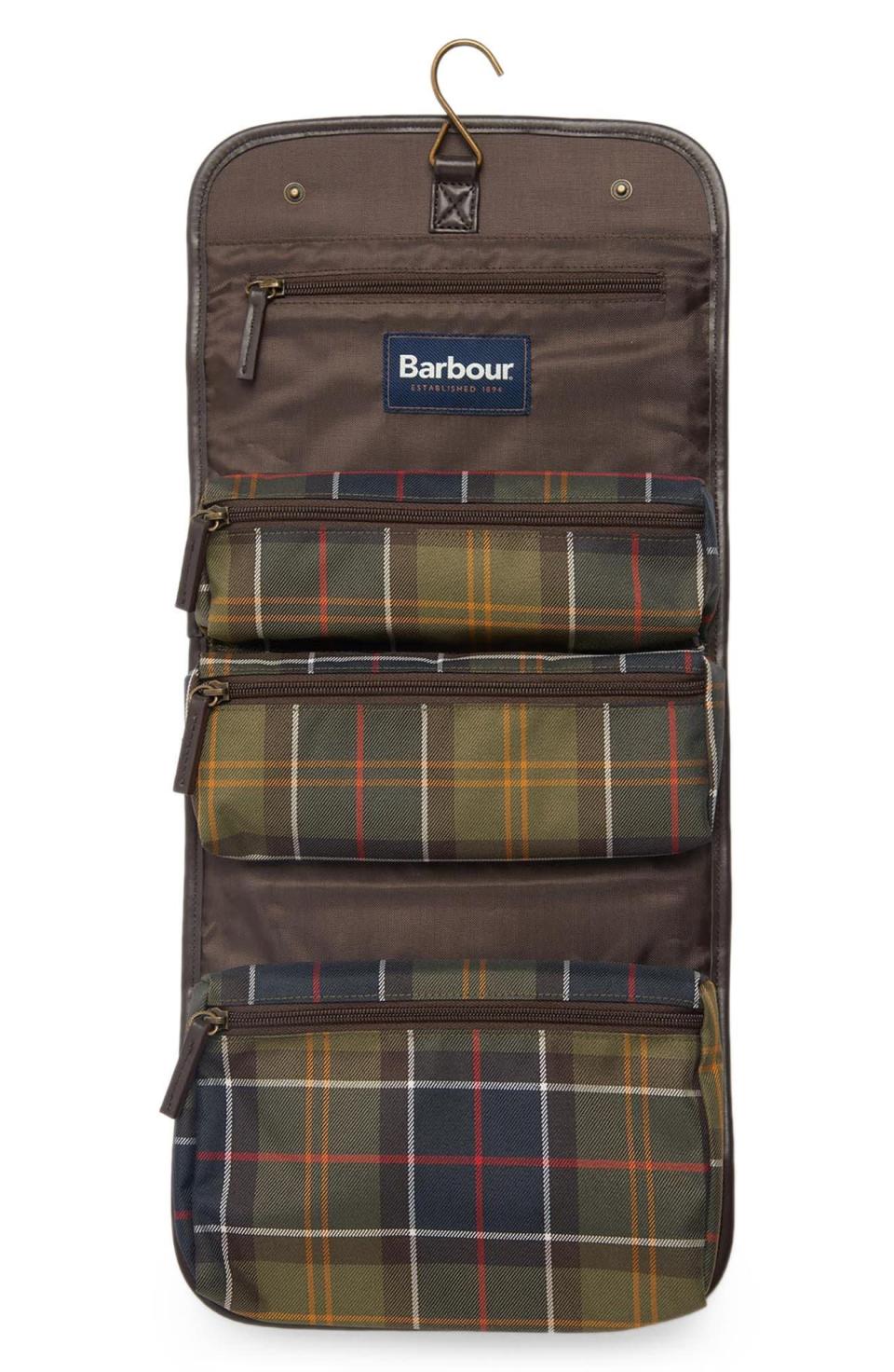 <p><strong>Barbour</strong></p><p>nordstrom.com</p><p><strong>$70.00</strong></p><p><a href="https://go.redirectingat.com?id=74968X1596630&url=https%3A%2F%2Fwww.nordstrom.com%2Fs%2Fbarbour-tartan-hanging-dopp-kit%2F6470893&sref=https%3A%2F%2Fwww.townandcountrymag.com%2Fstyle%2Fbeauty-products%2Fg40195370%2Fbest-toiletry-bags-women%2F" rel="nofollow noopener" target="_blank" data-ylk="slk:Shop Now" class="link ">Shop Now</a></p><p>Whether you're heading to Scotland this summer or are just a fan of Barbour's signature tartan prints, this hanging dopp kit makes for a worthy travel splurge. Not only does it hang on a bathroom door for access to all your essentials, but it also folds up neatly for easy packing.</p>