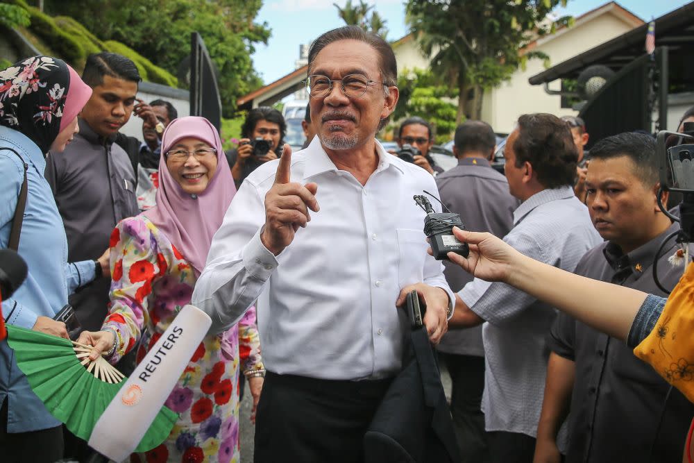 Datuk Seri Anwar Ibrahim speaks to reporters gathered outside his residence in Kuala Lumpur February 26, 2020. — Picture by Yusof Mat Isa