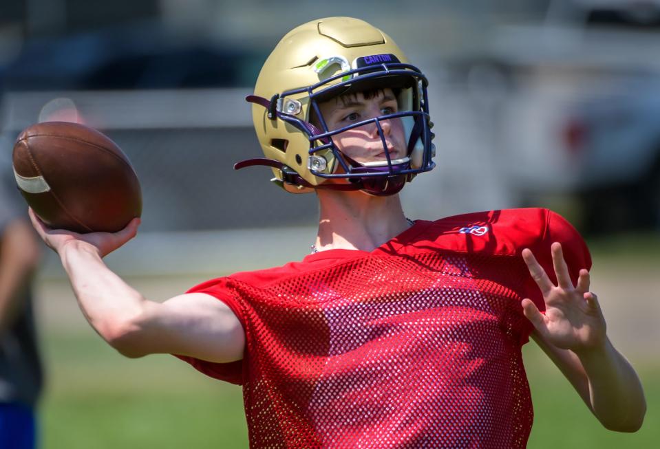 Canton Little Giant quarterback Cale Barnhart throws to a receiver during the 7-on-7 camp Saturday, July 23, 2022 at Washington Community High School.