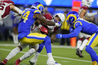 Los Angeles Rams outside linebacker Leonard Floyd, left, tackles Arizona Cardinals running back James Conner during the first half of an NFL wild-card playoff football game in Inglewood, Calif., Monday, Jan. 17, 2022. (AP Photo/Jae C. Hong)