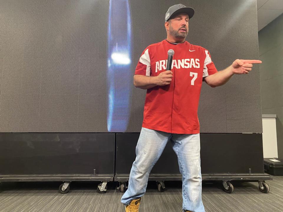 Garth Brooks wore an Arkansas baseball jersey when he opened a question and answer session with reporters Friday in Fayetteville. Saturday night he plays Razorback Stadium.