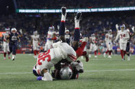 New England Patriots wide receiver Lil'Jordan Humphrey, below, arrives in the end zone for a touchdown as New York Giants cornerback Zyon Gilbert (38) defends during the second half of a preseason NFL football game, Thursday, Aug. 11, 2022, in Foxborough, Mass. (AP Photo/Michael Dwyer)