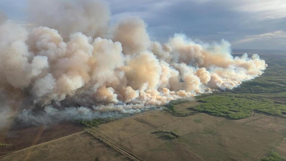 This May 10, 2024 aerial photo from the Alberta Wildfire Service shows smoke from wildfires burning in the Grande Prairie forest area near Teepee Creek in Alberta, Canada.  (Photo by Handout/Alberta Wildfire Service/AFP) (Handout/Alberta Wildfire Service/AFP via)