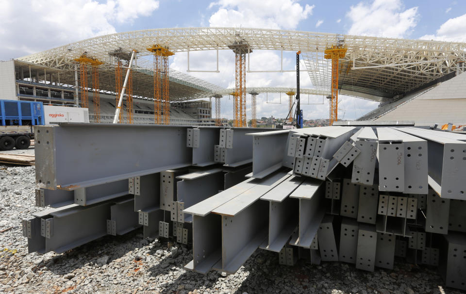 Steel beams sit outside the Arena de Sao Paulo in Sao Paulo, Brazil, Sunday, Dec. 8, 2013. Six matches of the 2014 soccer World Cup will be played in Sao Paulo. (AP Photo/Ferdinand Ostrop)