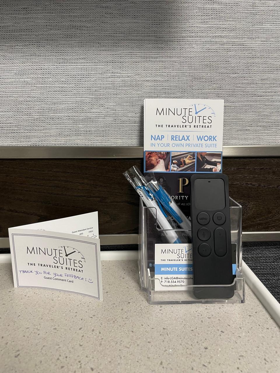 Minute Suites Express review card on desk