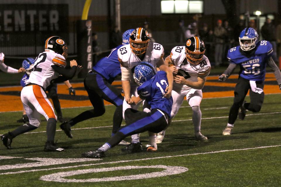 Gibsonburg's Connor Smith follows Martin Myerholtz through the hole.