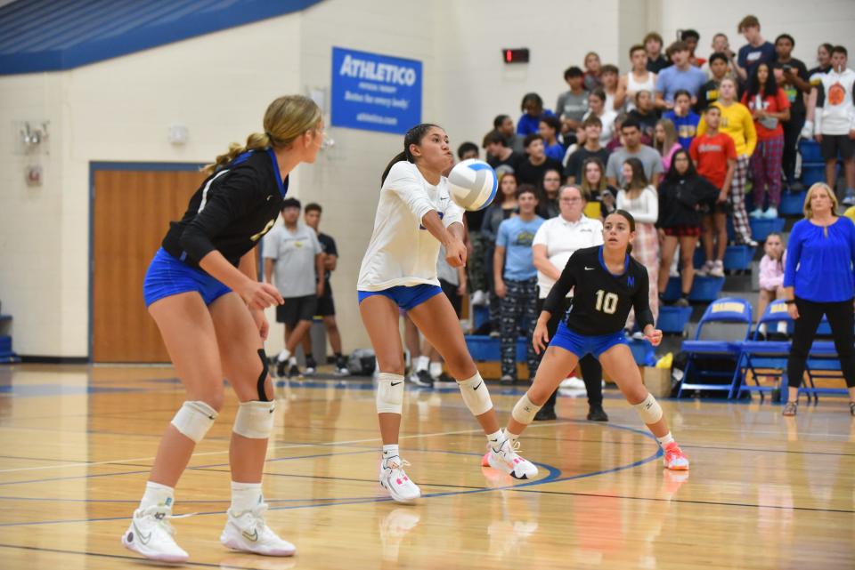 Madison's Veronica Flores gets a dig during a match against Clinton.