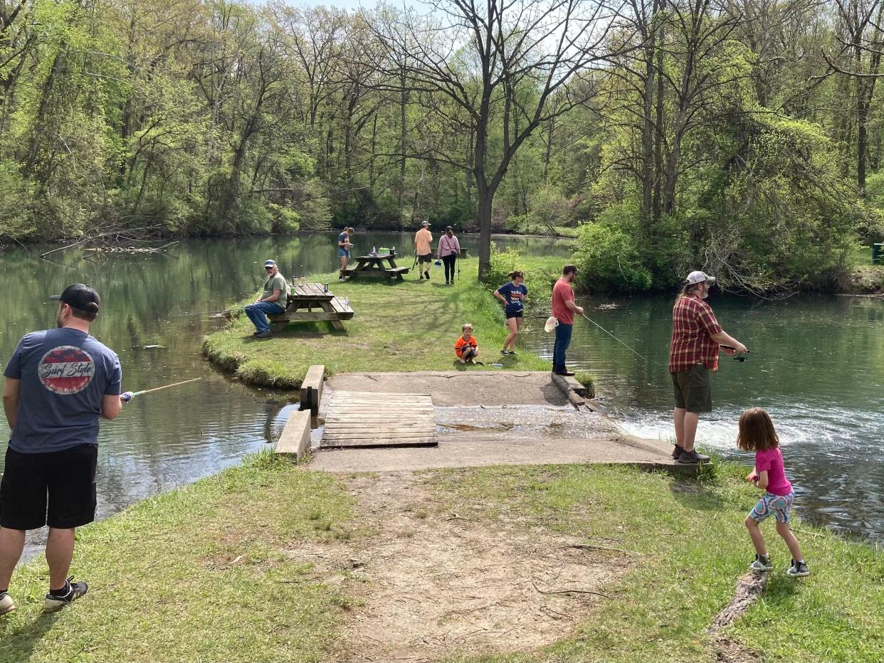 Visitors enjoy the annual free fishing day in June 2023 at the Izaak Walton League in South Bend.