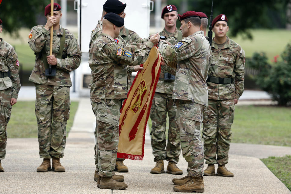 Lt. Gen. Christopher T. Donahue, front right, takes part of the Casing of the Colors during a renaming ceremony Friday, June 2, 2023, in Fort Liberty, N.C. The U.S. Army changed Fort Bragg to Fort Liberty as part of a broader initiative to remove Confederate names from bases. (AP Photo/Karl B DeBlaker)