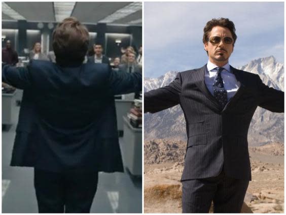 Swift matches the pose of Downey Jr's character in 'Iron Man' (Vevo / Disney)