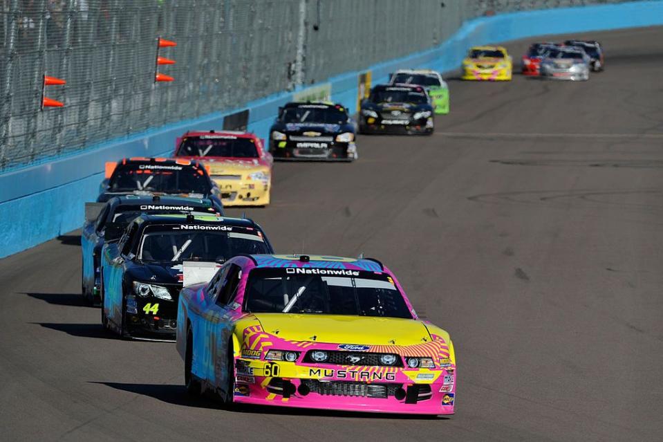 avondale, az november 09 travis pastrana, driver of the 60 roush fenway racing ford, leads a pack of cars during the nascar nationwide series servicemaster 200 at phoenix international raceway on november 9, 2013 in avondale, arizona photo by rainier ehrhardtnascar via getty images