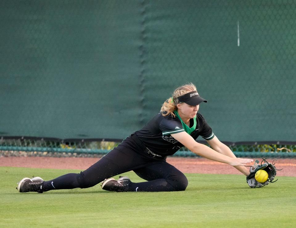 Stetson's Kami Eppley chases down a grounder in the outfield during a game with the University of Florida, Tuesday, March 22, 2022.