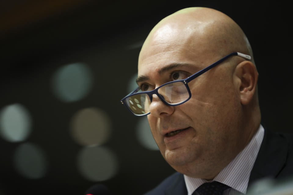 Italian Coast Guard Commander Andrea Tassara talks during a Civil Liberties and Justice Committee at the European Parliament in Brussels, Thursday, Oct. 3, 2019. (AP Photo/Francisco Seco)