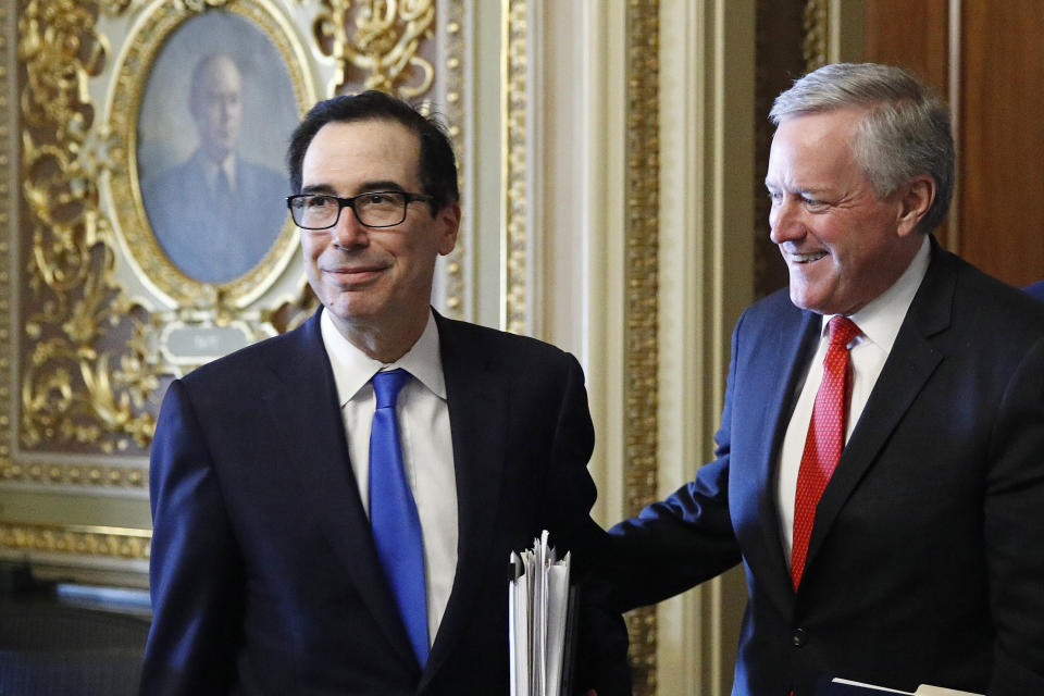 Treasury Secretary Steve Mnuchin, left, and White House chief of staff Mark Meadows step out of a meeting as the Senate negotiated a coronavirus relief bill in March. (Photo: ASSOCIATED PRESS)