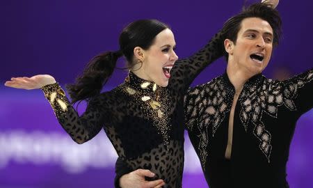 Figure Skating - Pyeongchang 2018 Winter Olympics - Ice Dance short dance competition - Gangneung Ice Arena - Gangneung, South Korea - February 19, 2018 - Tessa Virtue and Scott Moir of Canada perform. REUTERS/Phil Noble