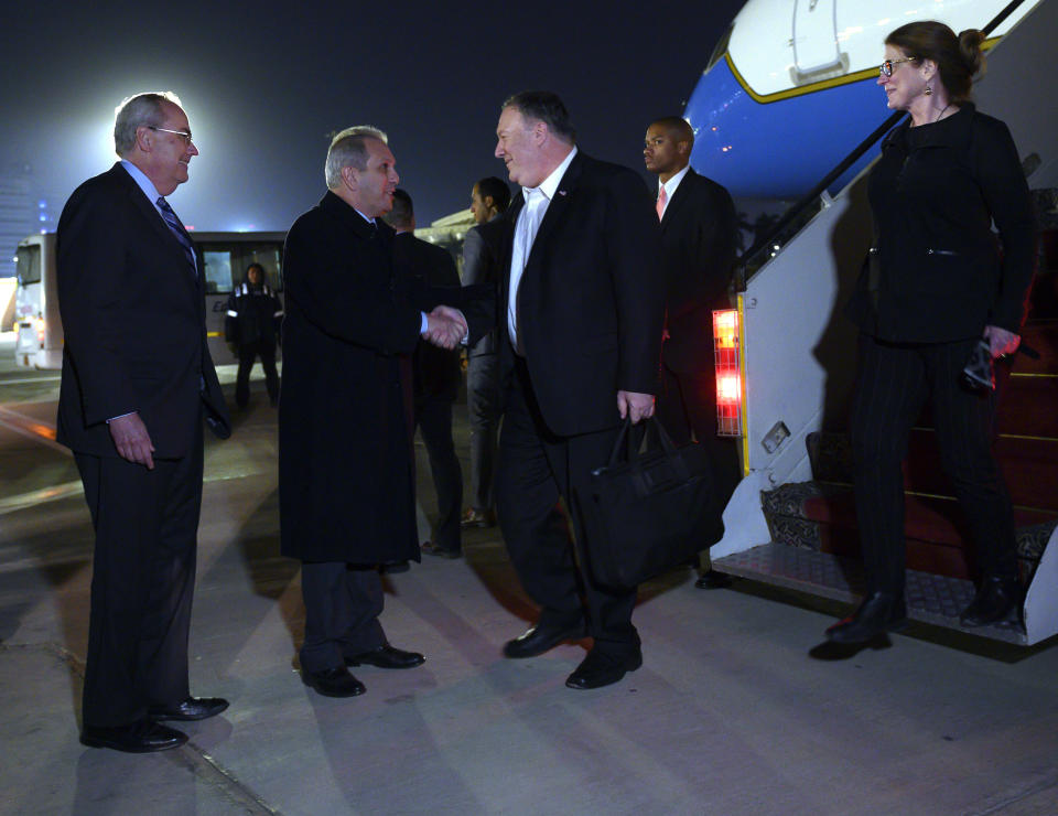 U.S. Secretary of State Mike Pompeo, and his wife Susan, right, are greeted by Assistant Foreign Minister For North and South American Affairs, Reda Habeeb Ibrahim Zaki , second from left, and Charge d'Affaires for the US Embassy in Egypt, Tom Goldberger, at they arrive at Cairo International Airport in Cairo, Wednesday, Jan. 9, 2019. (Andrew Caballero-Reynolds/Pool Photo via AP)