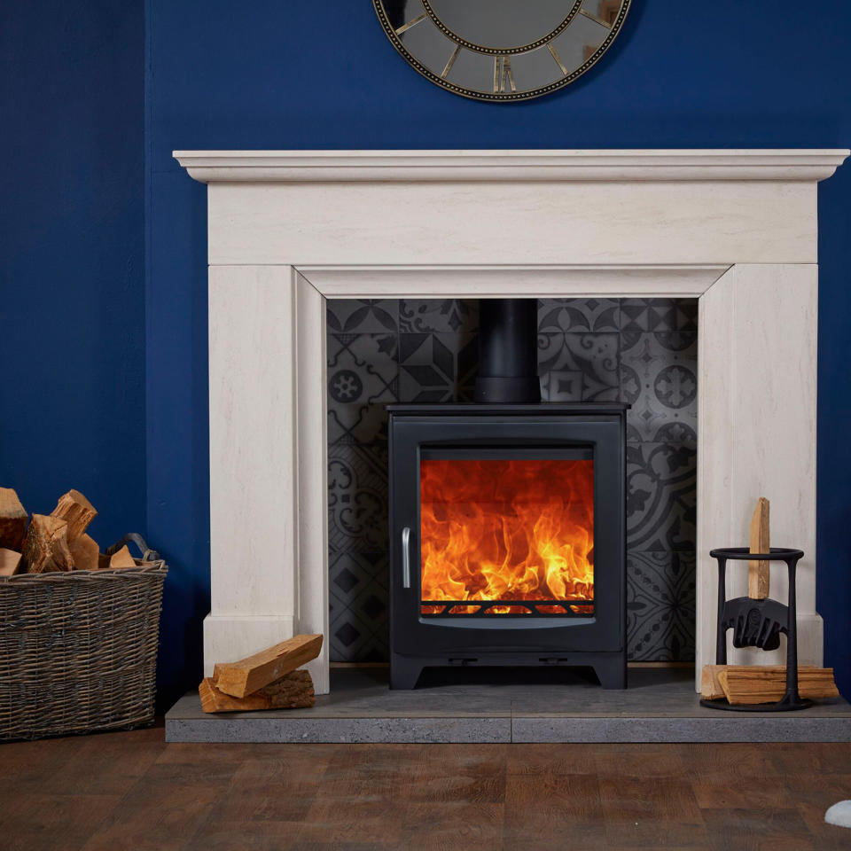 Limestone fireplace with burning fire