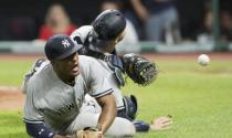 Jul 14, 2018; Cleveland, OH, USA; New York Yankees third baseman Miguel Andujar (41) and catcher Austin Romine (28) attempt to field a pop up hit by Cleveland Indians right fielder Brandon Guyer during the ninth inning at Progressive Field. Mandatory Credit: Ken Blaze-USA TODAY Sports