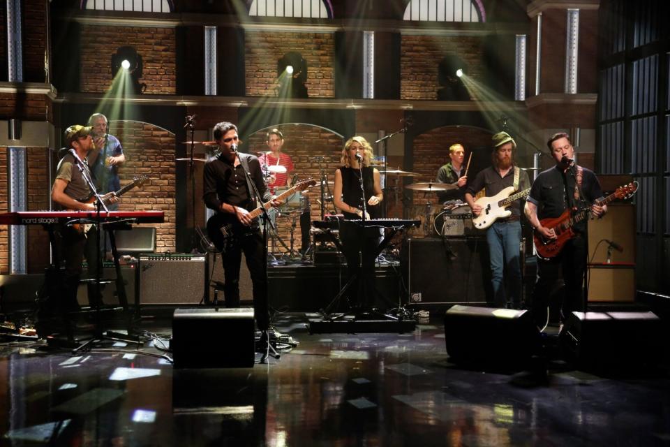 LATE NIGHT WITH SETH MEYERS -- Episode 233 -- Pictured: (l-r) Tom Peloso, Jim Fairchild, Davey Brozowski, Lisa Molinaro, Jeremiah Green, Russell Higbee, Isaac Brock of musical guest Modest Mouse perform on July 20, 2015 -- (Photo by: Peter Kramer/NBCU Photo Bank/NBCUniversal via Getty Images via Getty Images)