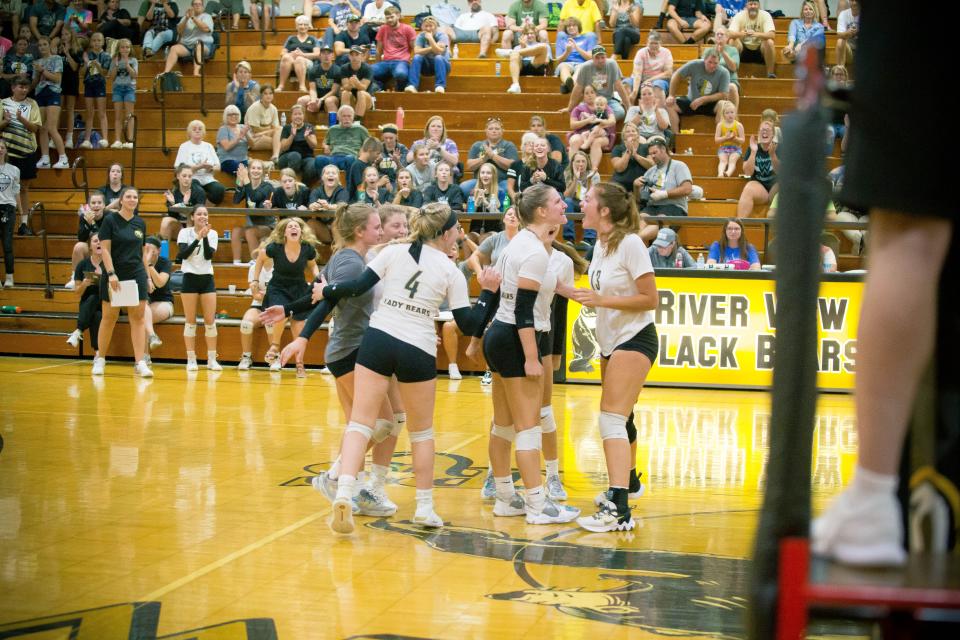 The River View Lady Bears celebrate a point during Thursday's win over Maysville.