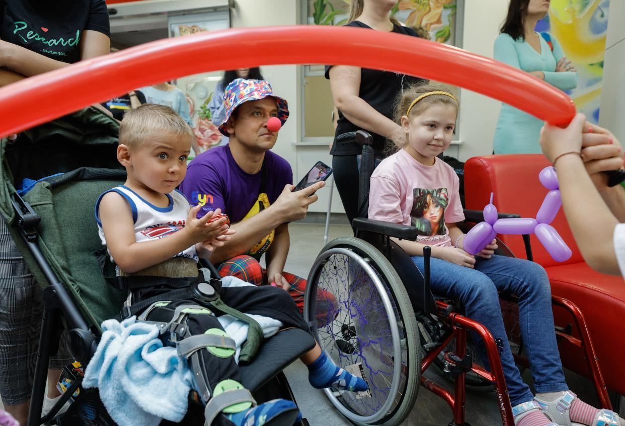 Ukrainian children, currently admitted at the Ohmatdyt Hospital, attend a party organized for them in Kyiv, Ukraine (EPA)