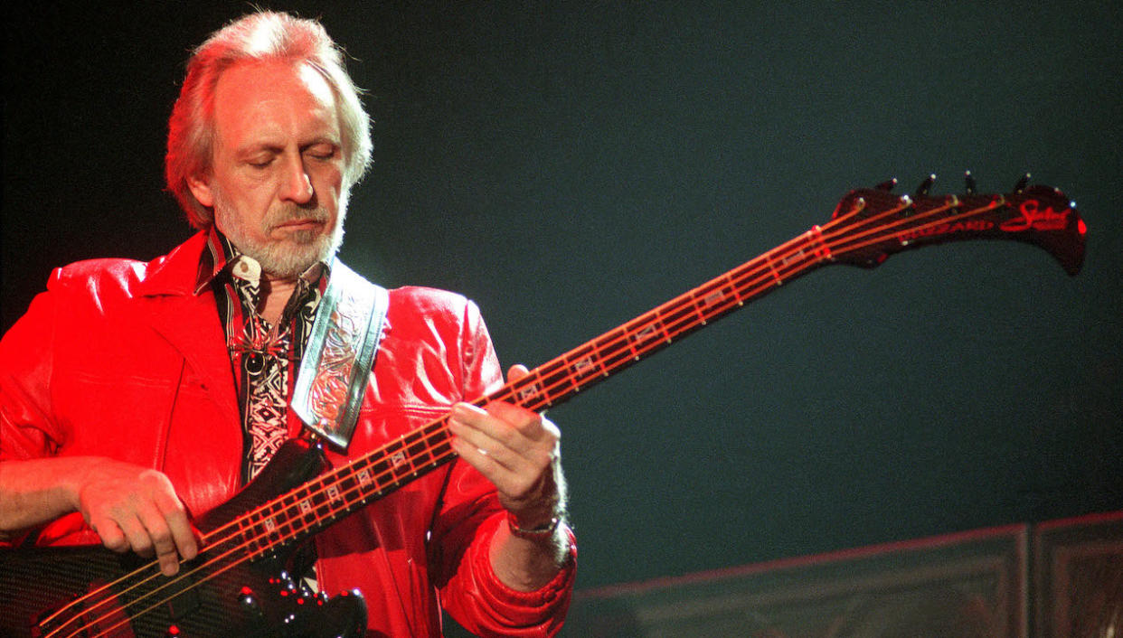  John Entwistle of The Who on stage, performing their album 'Quadrophenia', Ahoy, Rotterdam, 11th May 1997. He plays a Status Graphite Buzzard Bass guitar. 