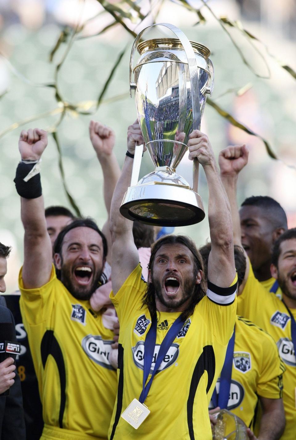 The Crew's Frankie Hejduk holds up the MLS Cup trophy after their 3-1 win over the New York Red Bulls in 2008.