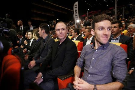 Riders Chris Froome (C) of Britain and Adam Yates of Britain (R) attend the presentation of the itinerary of the 2017 Tour de France cycling race during a news conference in Paris, France, October 18, 2016. REUTERS/Benoit Tessier