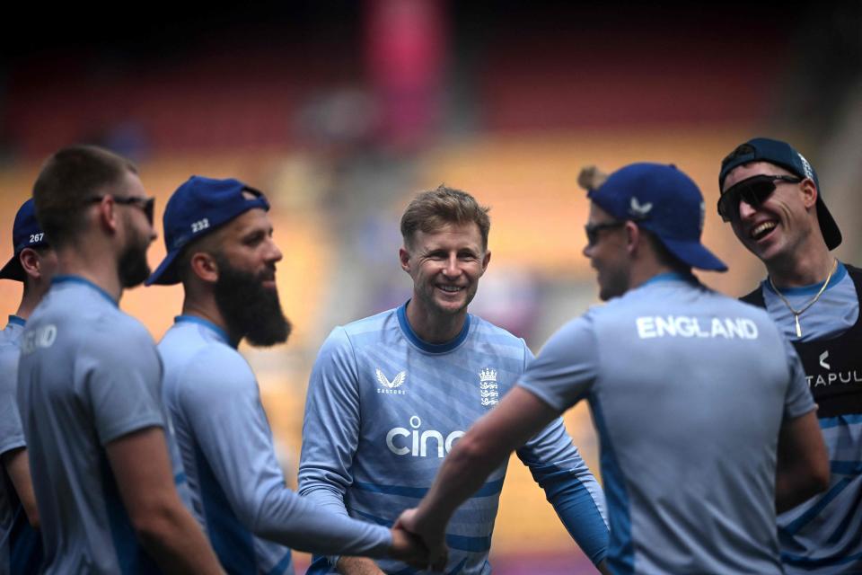 England warm up ahead of the match (AFP via Getty Images)