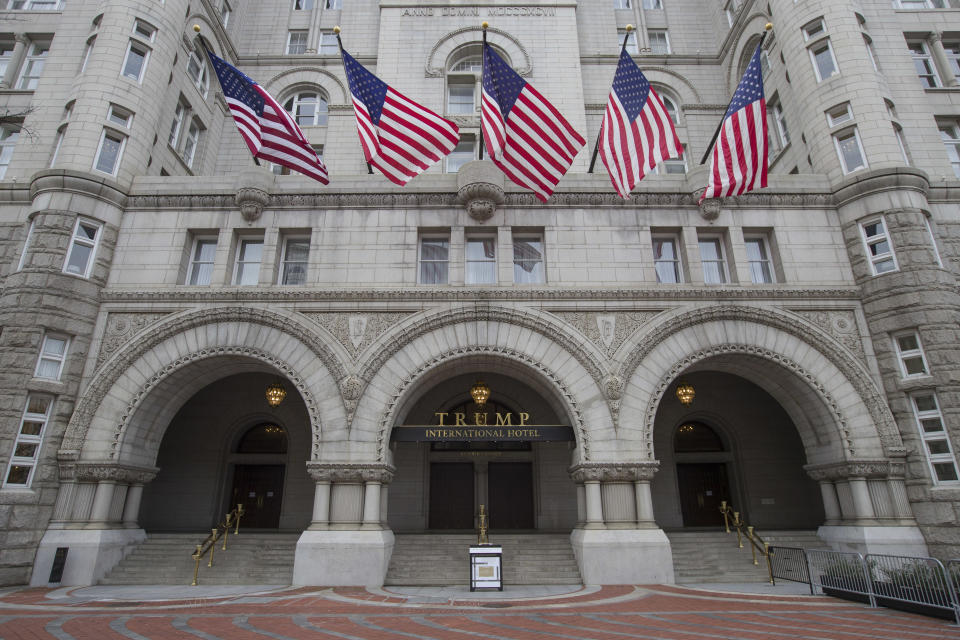 The Old Post Office Pavilion Clock Tower, which remains open during the partial government shutdown, above the Trump International Hotel, Friday, Jan. 4, 2019 ,in Washington. (AP Photo/Alex Brandon)