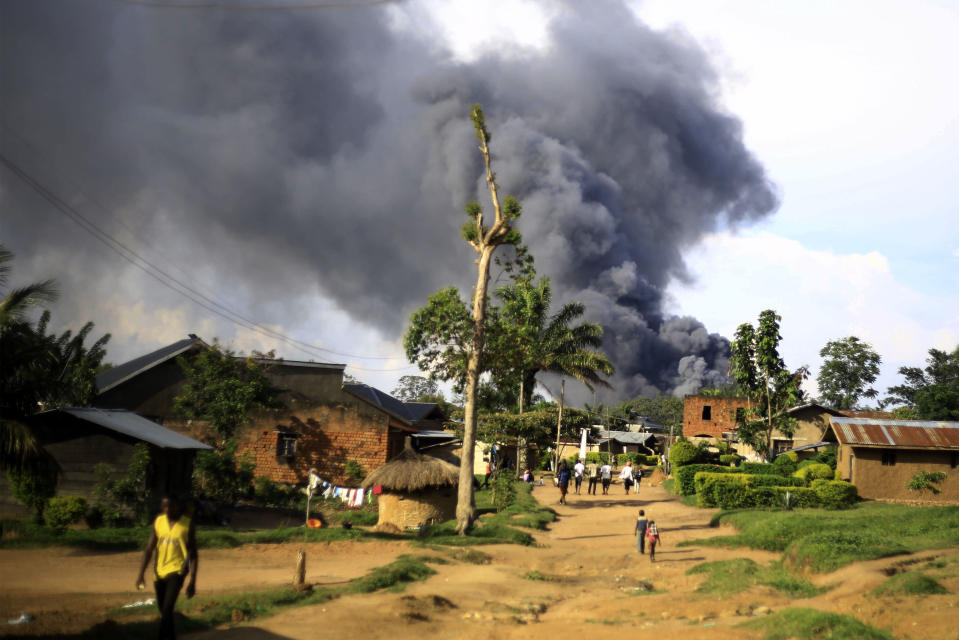 Smoke from the United Nations compound rises in Beni, Democratic Republic of Congo, Monday, Nov. 25, 2019. Angry residents of this eastern Congo city burned the town hall and stormed the UN peacekeeping mission, known as MONUSCO, after Allied Democratic Forces rebels killed eight people and kidnapped nine overnight. (AP Photo/Al-hadji Kudra Maliro)
