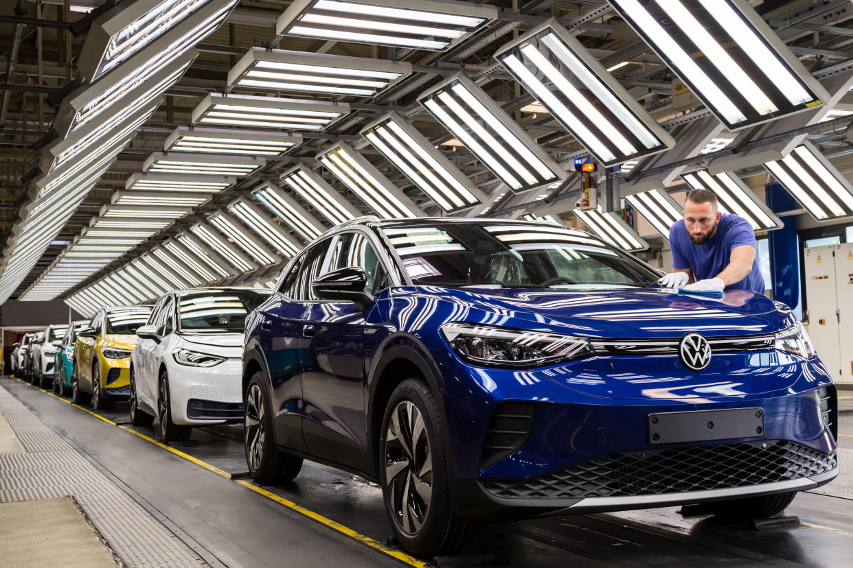 ZWICKAU, GERMANY - SEPTEMBER 18: Workers assemble the new Volkswagen ID.4 electric sport utility vehicle (SUV) at the VW factory on September 18, 2020 in Zwickau, Germany. Volkswagen will officially present the ID.4 towards the end of September. In addition, Volkswagen also produces the smaller ID.3 at the Zwickau plant. Both cars are meant to lead the company towards mass sales in the electric car market and provide it with strong competition against rival Tesla. (Photo by Jens Schlueter/Getty Images)