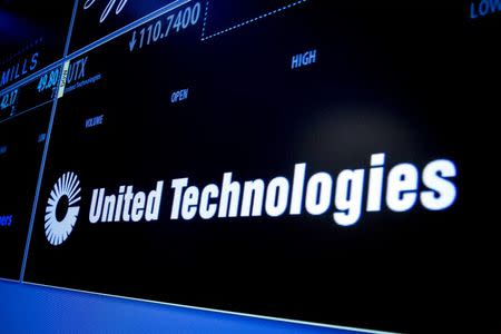 The ticker symbol for United Technologies is displayed on a screen on the floor of the New York Stock Exchange July 20, 2015. REUTERS/Brendan McDermid