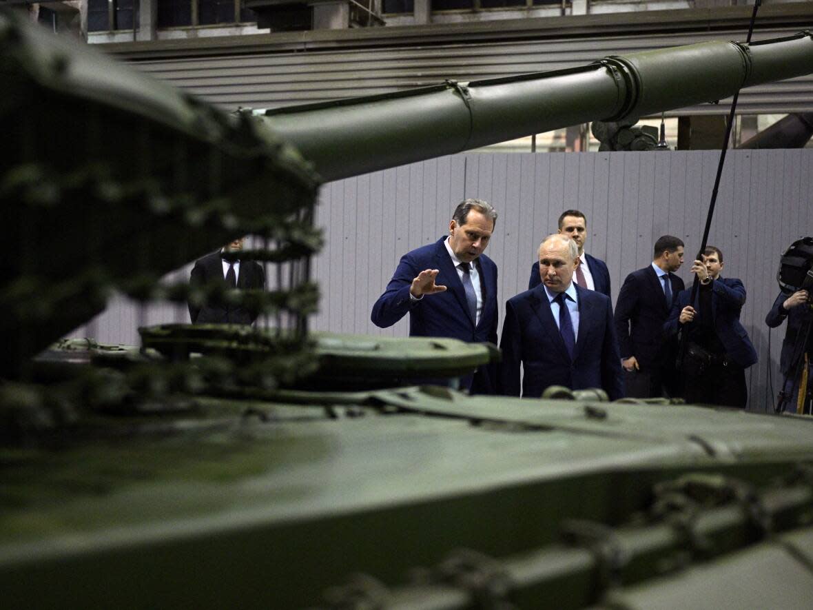 Russia's President Vladimir Putin visits a military plant in Nizhny Tagil, Russia in February 2024. In a speech that month, he boasted about the country's economy, and its ability to ramp up its military industrial complex, in the face of unprecedented sanctions.  (Sputnik/Ramil Sitdikov/Pool/Reuters - image credit)