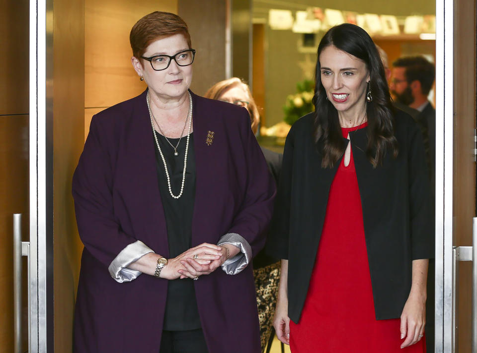 CORRECTS SPELLING TO MARISE INSTEAD OF MARISA - New Zealand Prime Minister Jacinda Ardern, right, greets Australian Foreign Minister Marise Payne in Wellington, New Zealand, Monday, Dec 16, 2019. Payne is in Wellington to thank some of the first responders who helped at the White Island volcano eruption on Dec. 9. (Hagen Hopkins/Pool Photo via AP)