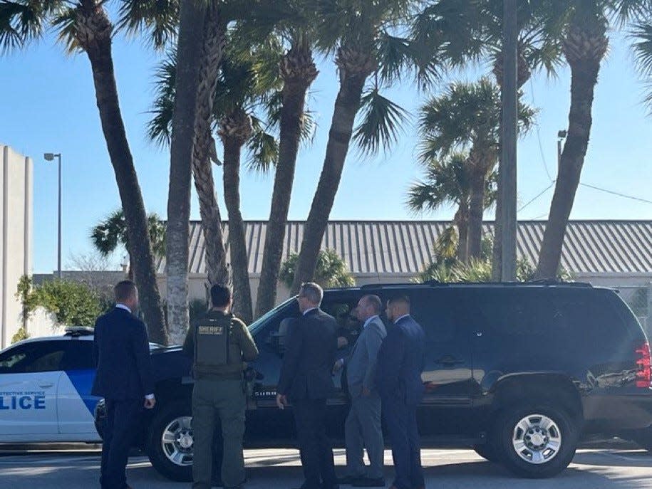 What look like Secret Service agents wait for former President Donald Trump to exit after the hearing he is attending in the federal courthouse in his criminal documents case.