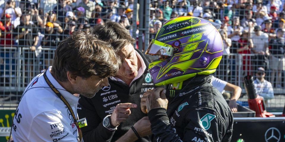 mercedes team principal toto wolff speaking with lewis