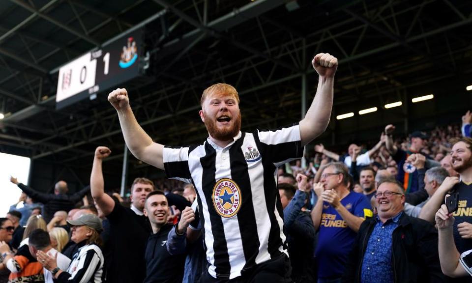 Newcastle United fans celebrate. 