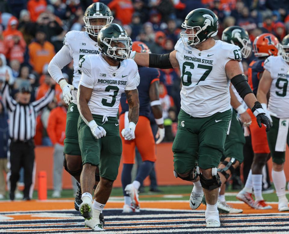 MSU's J.D. Duplain, left, and Jarek Broussard, right and the rest of the Spartans had success in the trenches at Illinois.