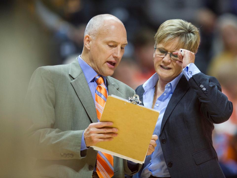 Tennessee assistant coach Dean Lockwood talks with head coach Holly Warlick during a game against Alabama State in 2017. Both were assistant coaches under Pat Summitt, the legendary coach who retired in 2012 after a diagnosis of early-onset dementia.