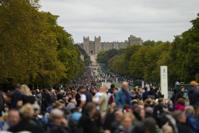 People stand along the Long Walk outside Windsor Castle as they wait for the coffin of Queen Elizabeth II to arrive in Windsor (Alastair Grant/PA) (PA Wire)