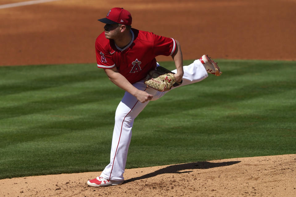 Los Angeles Angels starting pitcher Dylan Bundy throws against the Texas Rangers during the first inning of a spring training baseball game, Wednesday, March 3, 2021, in Tempe Ariz. (AP Photo/Matt York)