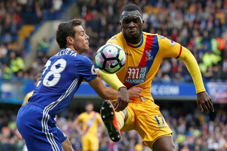 Chelsea's Cesar Azpilicueta (L) fights for the ball with Crystal Palace's Christian Benteke during their English Premier League match, at Stamford Bridge in London, on April 1, 2017