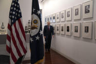 U.S. Ambassador to China Terry Branstad walks past a photo wall of previous U.S. ambassadors to China before an interview at the U.S. embassy in Beijing on Tuesday, Sept. 29, 2020. The departing U.S. ambassador on Tuesday defended a tough approach to China that has riled relations between the world's two largest economies, saying the Trump administration has made progress on trade and that he hopes it will extend to other areas. (AP Photo/Ng Han Guan)