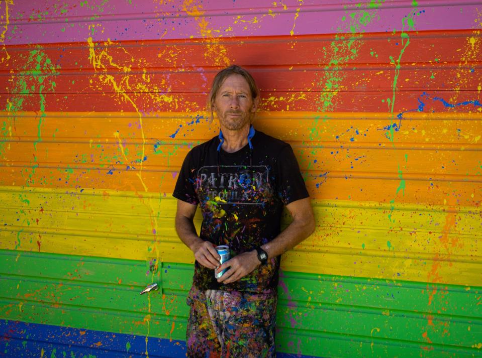 Artist Patrick Hasson poses in front of his former studio at The Rainbow House in Joshua Tree, Calif., on August 19, 2019.